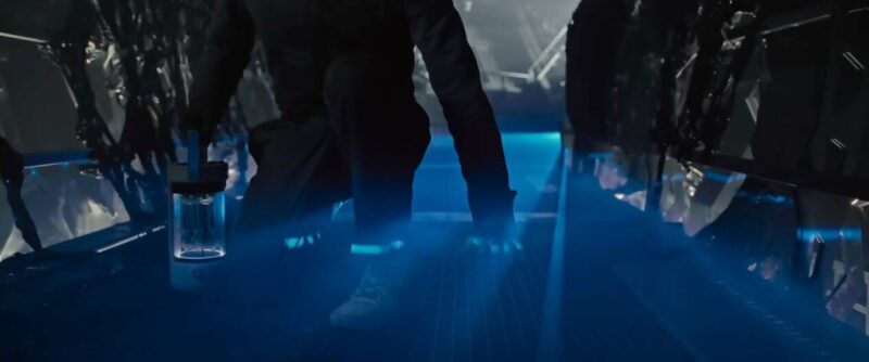 Andy crouching in blue iridescent mist